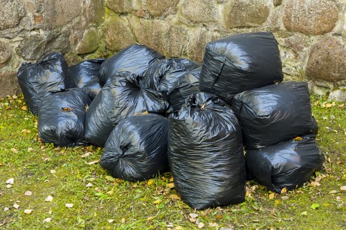 Professional rubbish removal team handling bulky items in an urban area